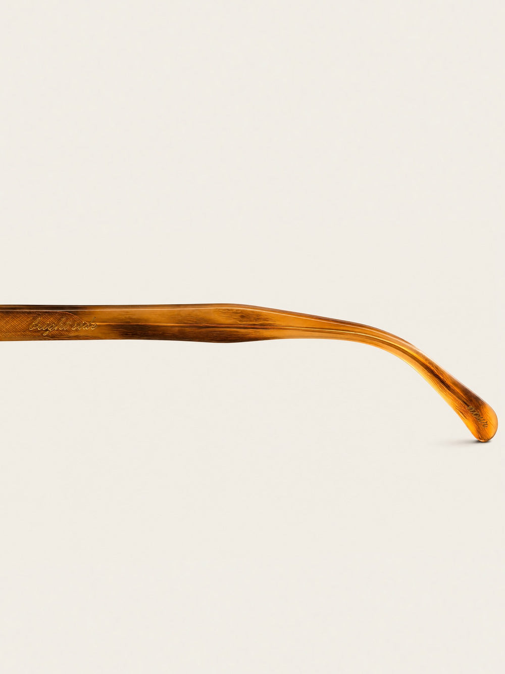 Nour honey tortoise temple arm with engraved detail