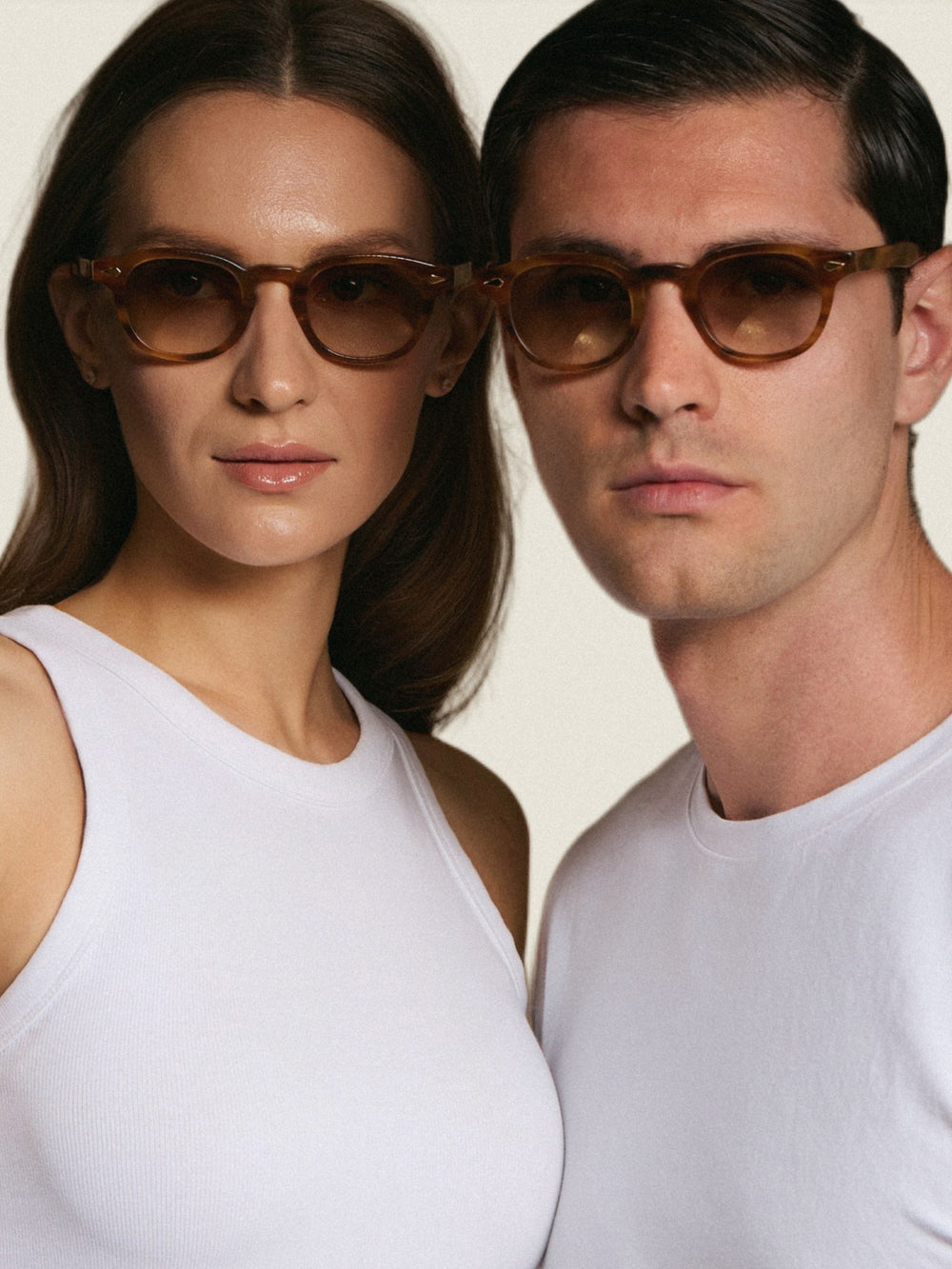 Two models wearing Nour sunglasses in honey tortoise
